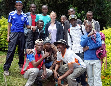 Trekker Kristen with a group of porters