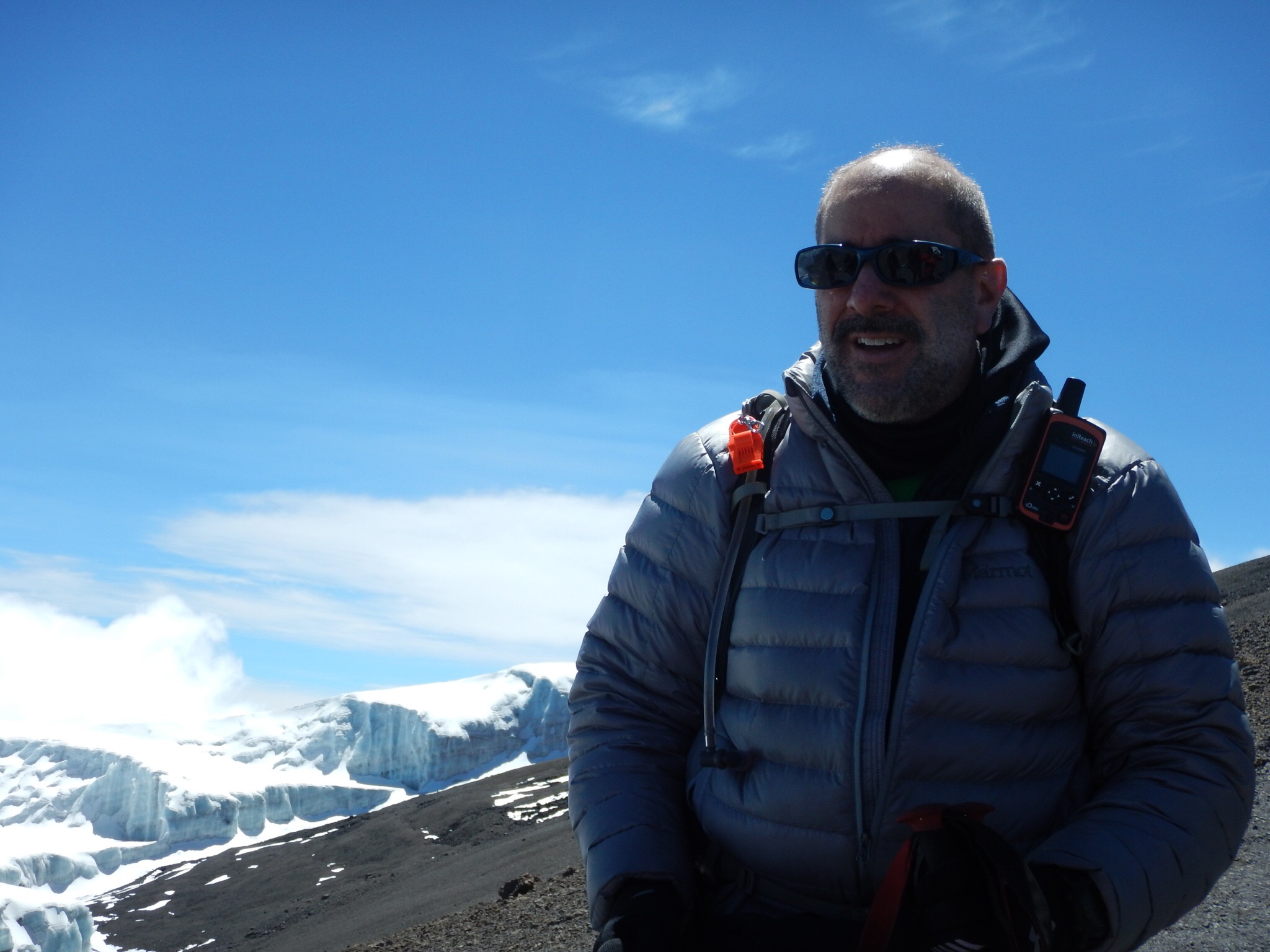 Brad S. against a scenic backdrop of Kilimanjaro's glaciers