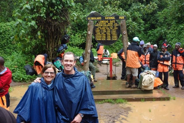 Mary and companion in front of the Lenosho Route gate