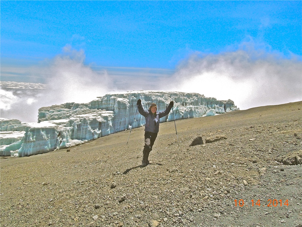 Tom O. poses with a glacier