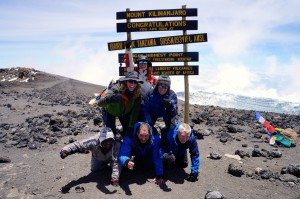 Natalie H. and her trekking party celebrate their summit success