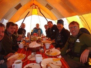 Satisfied trekkers relax in the dining tent after a meal