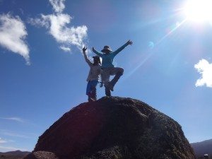 Laurel W. does yoga on a rock on Kilimanjaro