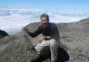 Bernie G. poses with a rock formation on Kilimanjaro