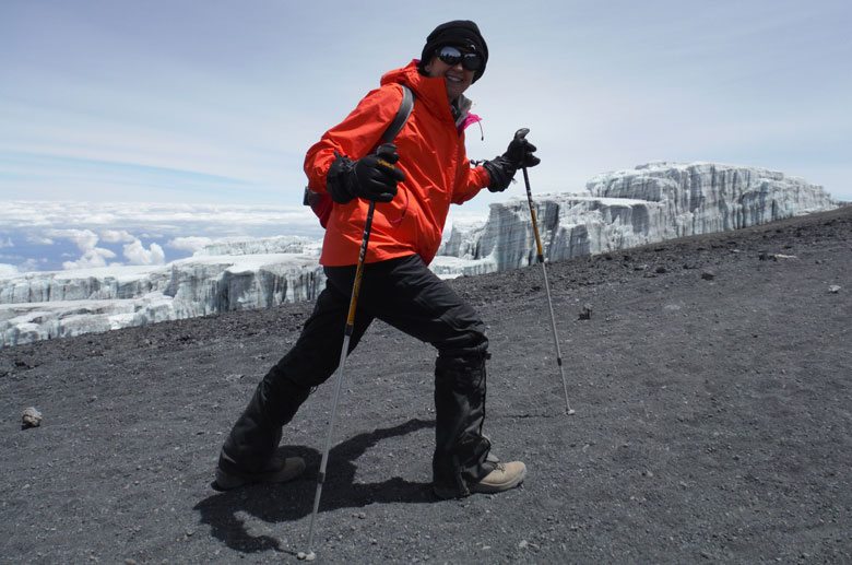 A Thomson trekker hikes beside glaciers