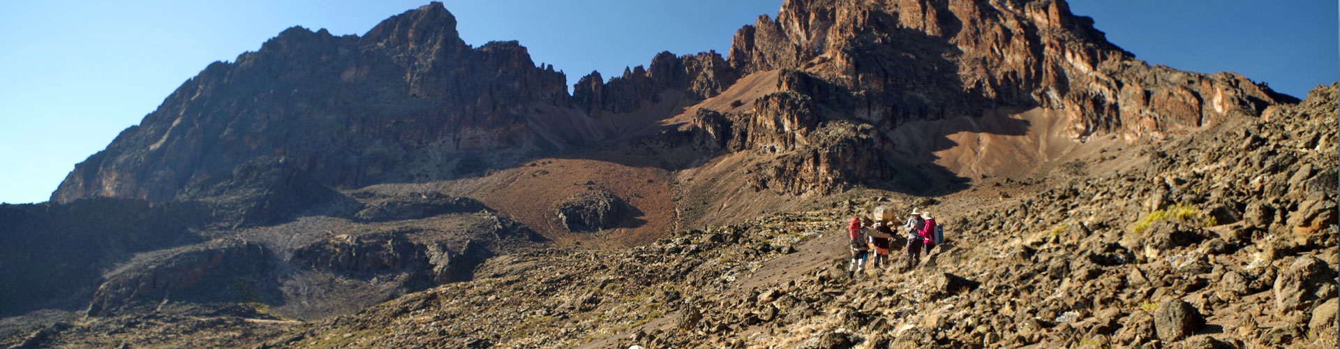 Trekkers in the vast landscape of Kilimanjaro