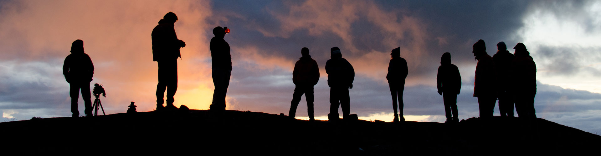 Thomson trekkers silhouetted as the sun rises