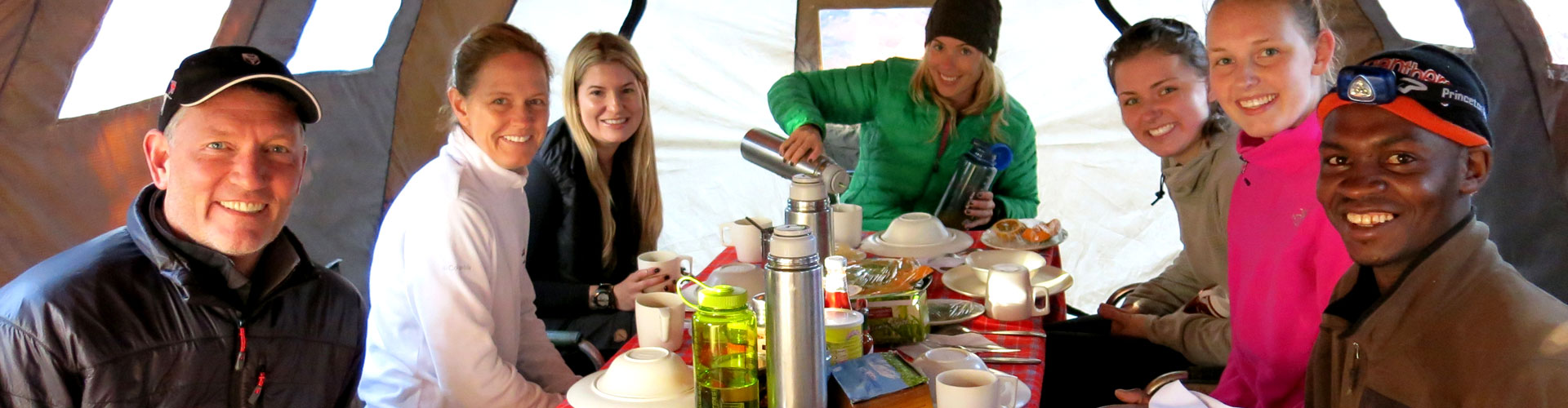 Climbers enjoying a meal together in the dining tent