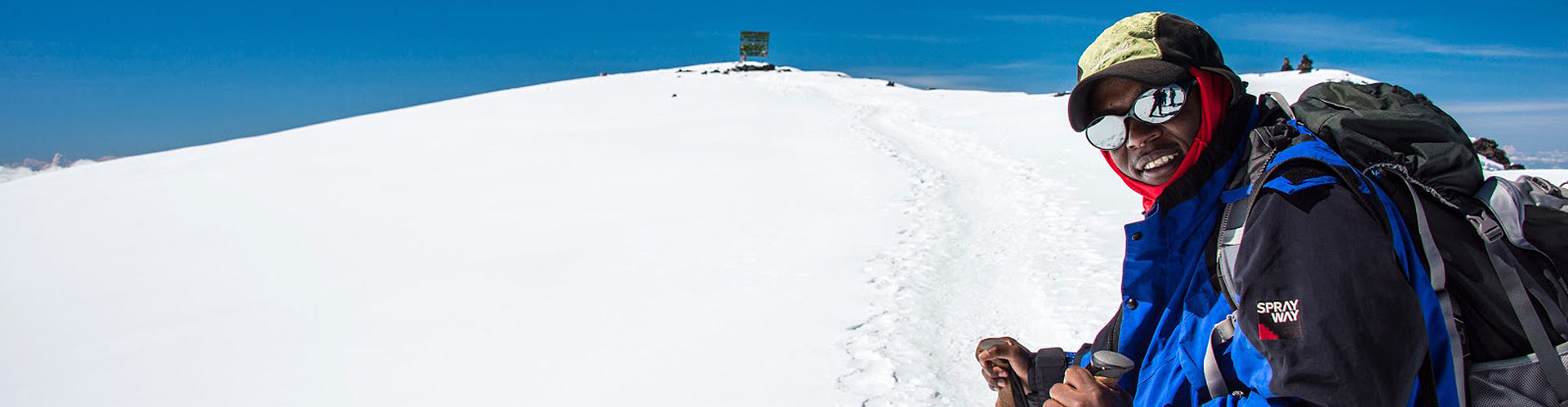 A guide leads the way to Uhuru peak