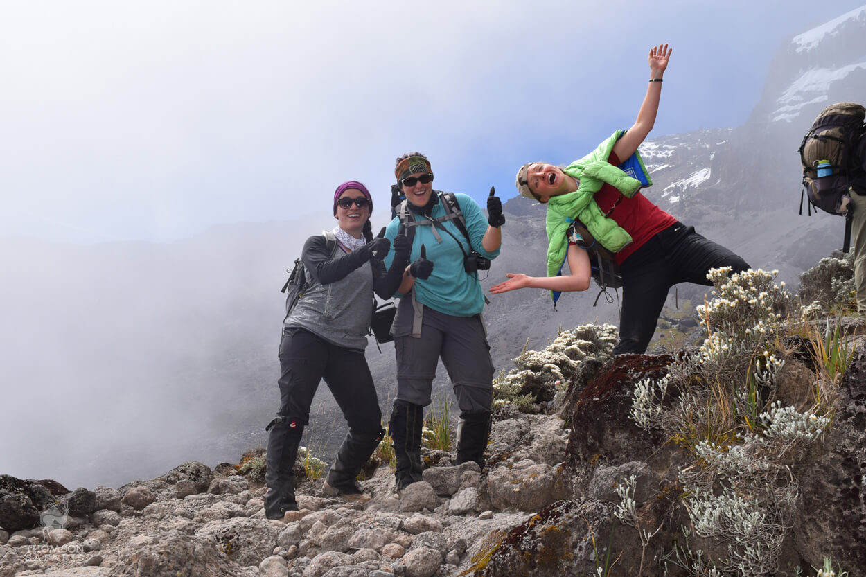 friends posing while climbing kilimanjaro
