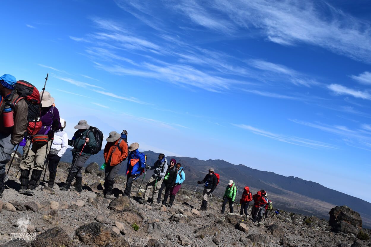 a group hiking up kilimanjaro