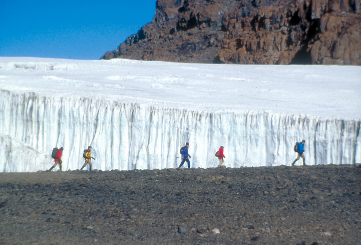rick trekking past glaciers on Kilimanjaro