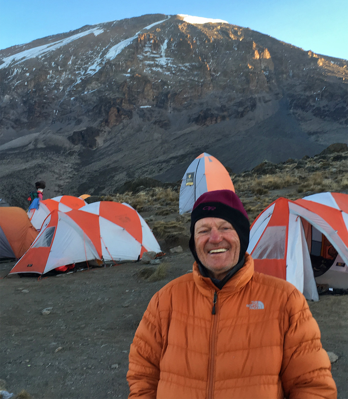 80 year old John at camp on Mount Kilimanjaro