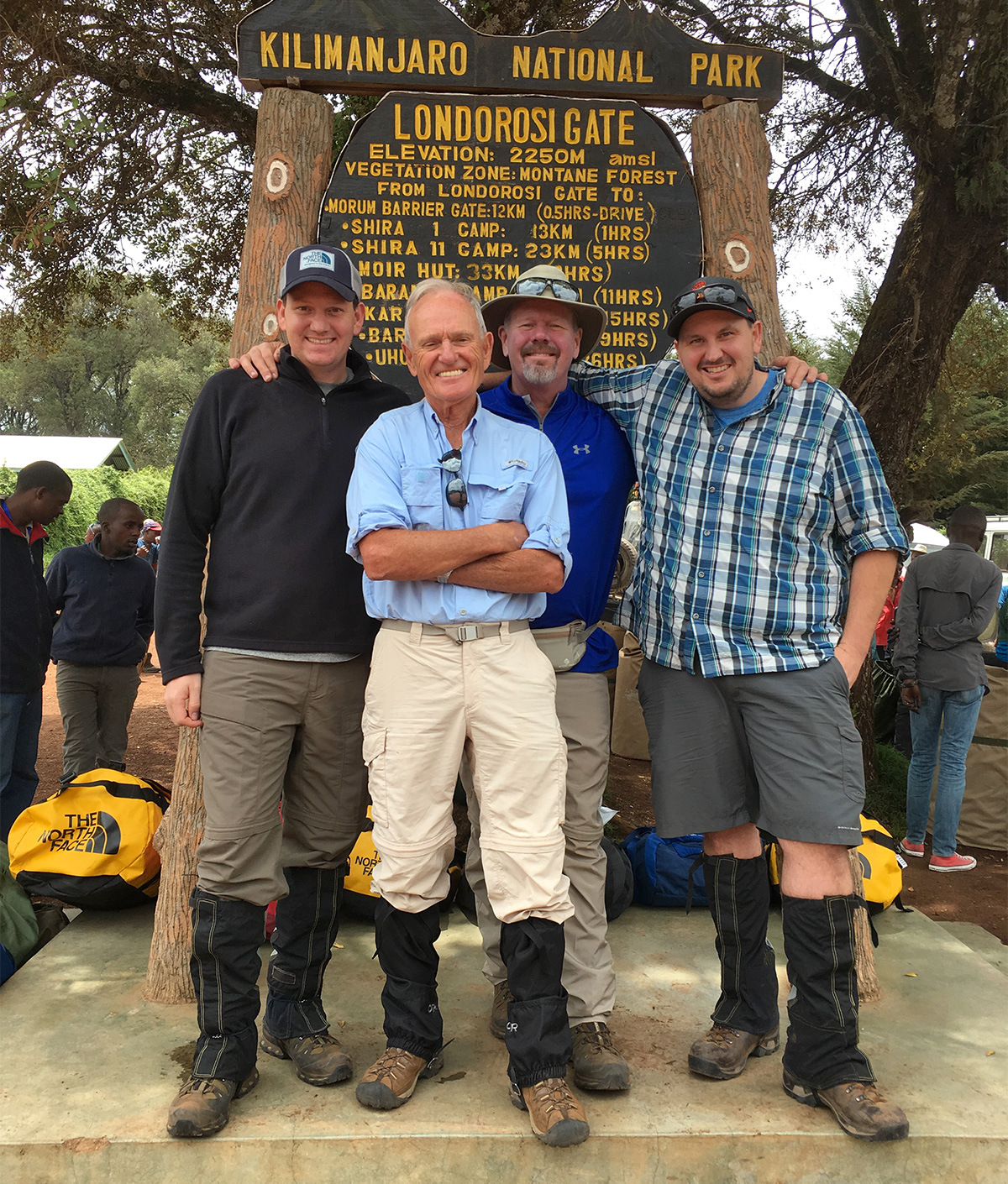 80 year old John with family at Kilimanjaro gate