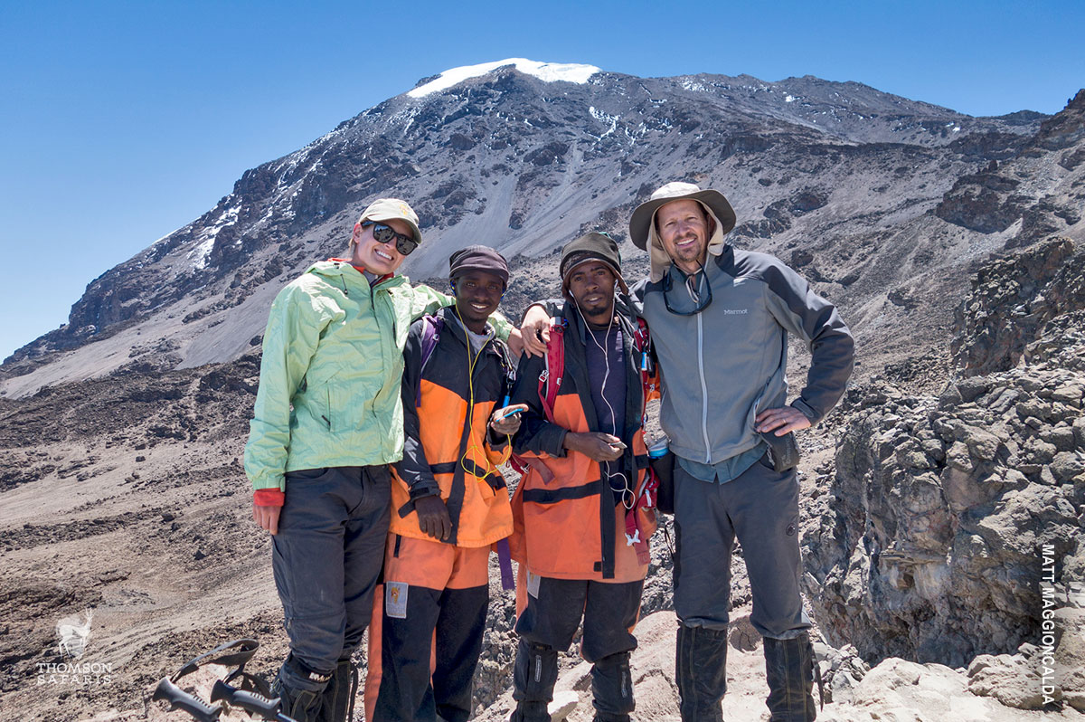 porter with thomson safaris trekkers