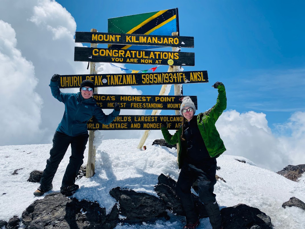thomson staffers at summit of mount kilimanjaro