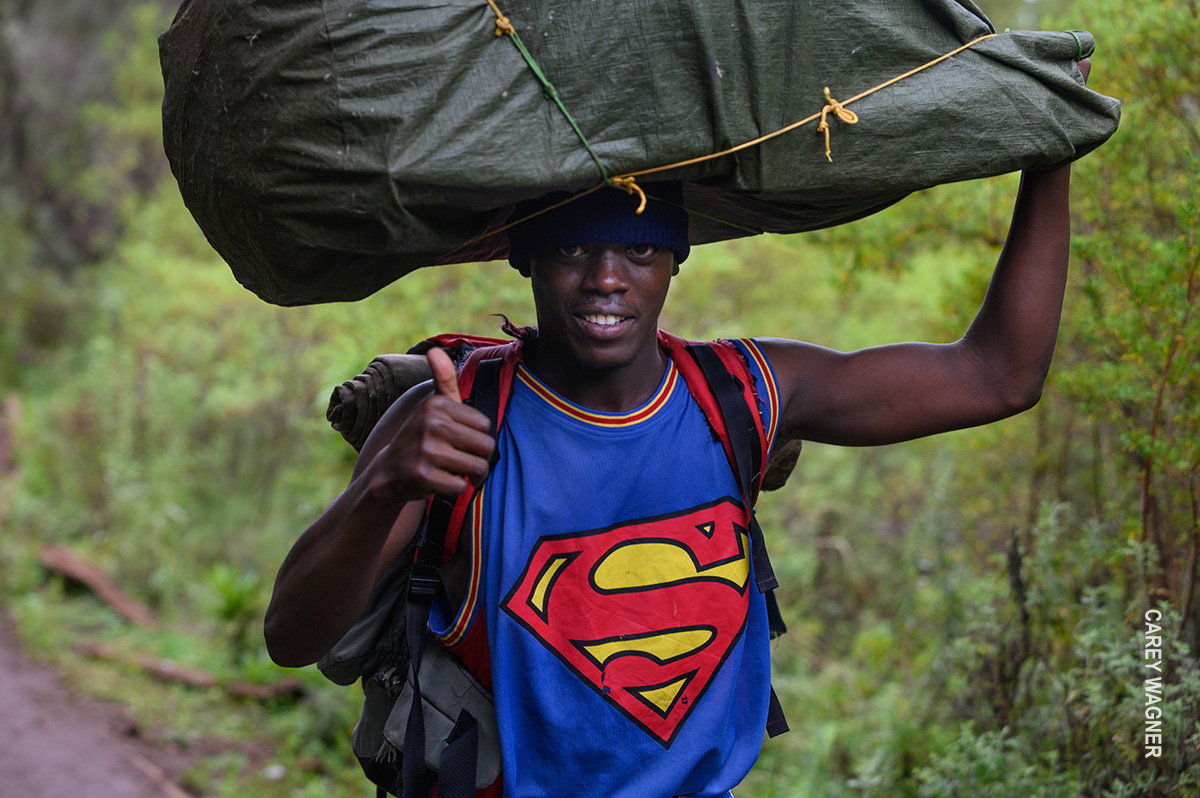 porter carrying gear on kilimanjaro