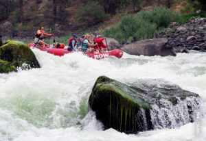 rafting through the salmon river rapids