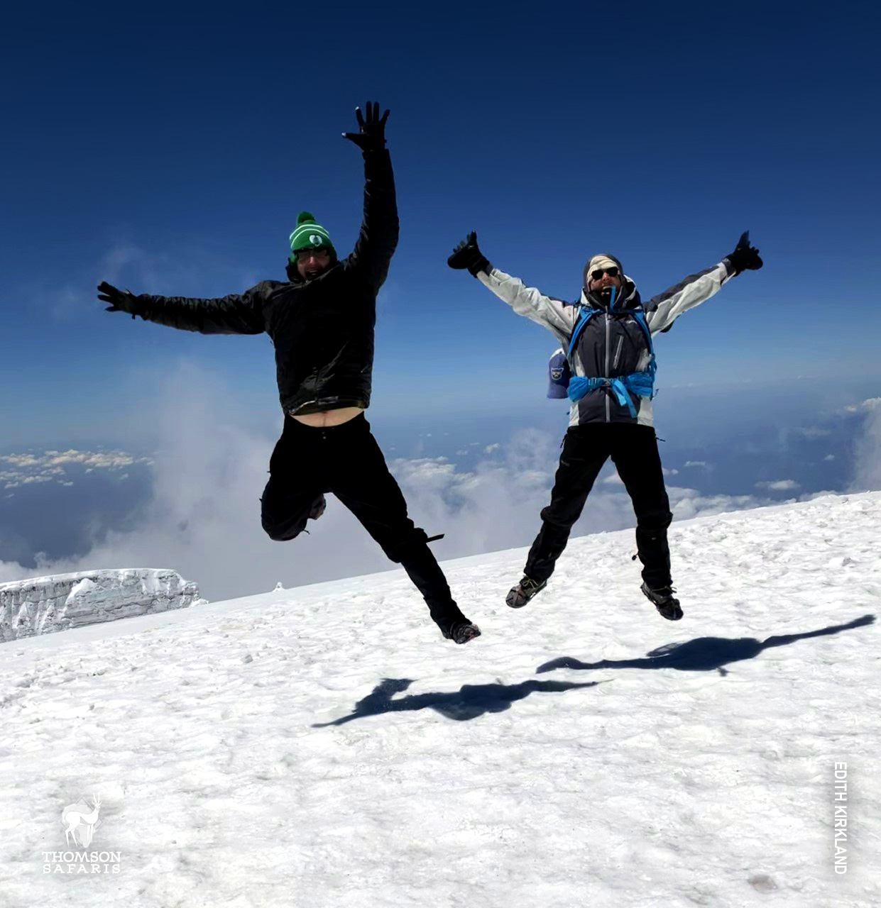 celebrate and jump at the summit