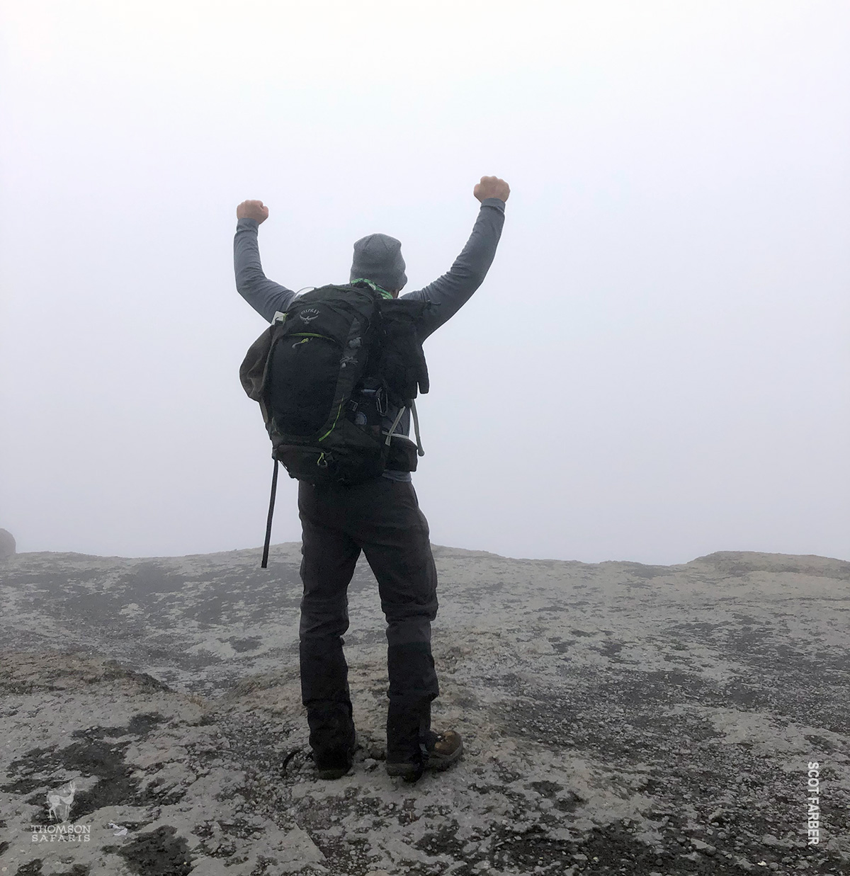 victorious hiker on kilimanjaro