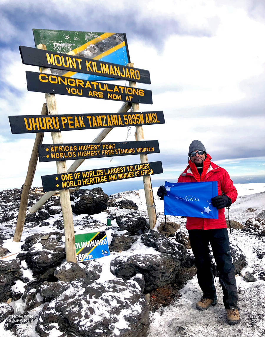 scot farber with make a wish flag on kilimanjaro