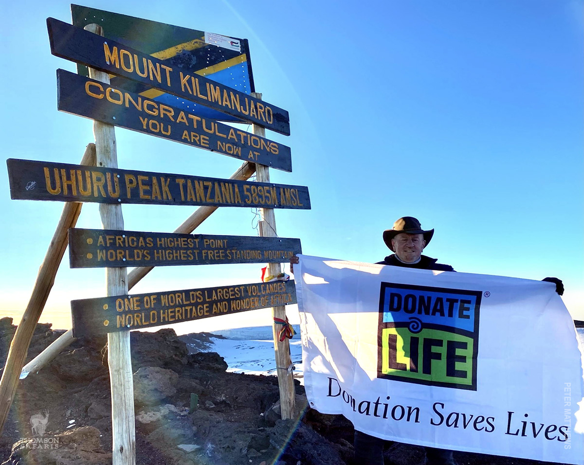gift of life organ donation flag on summit of mount kilimanjaro