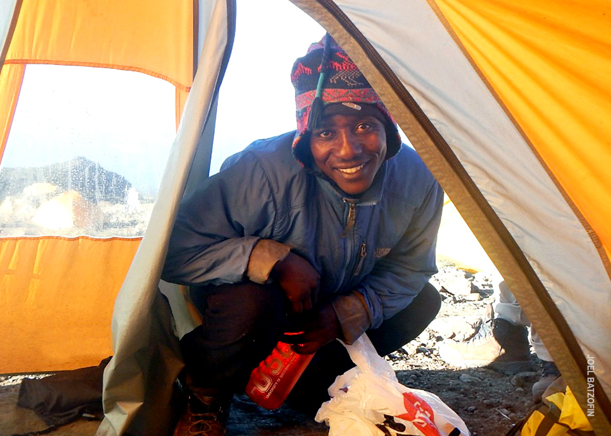 porter delivers coffee or tea at your tent in the morning