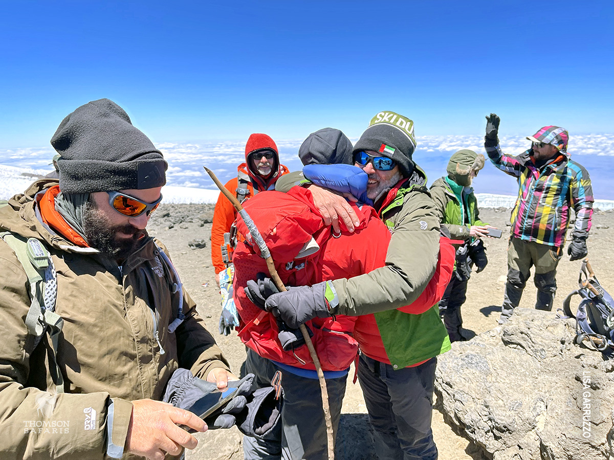 emotional moment at summit of mt kilimanjaro