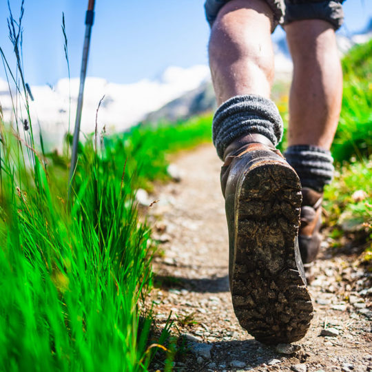 feet on hiking trail