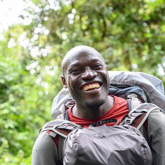 smiling porter on kilimanjaro