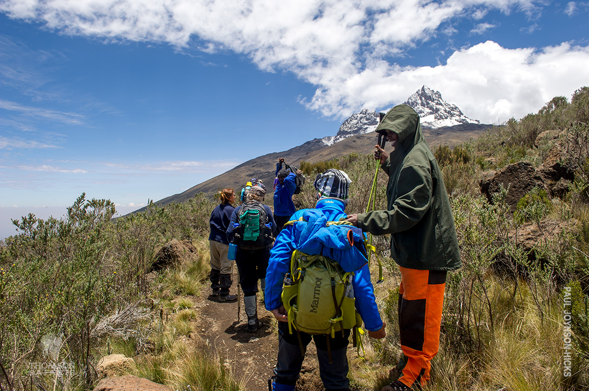 porter carrying backpack for trekker