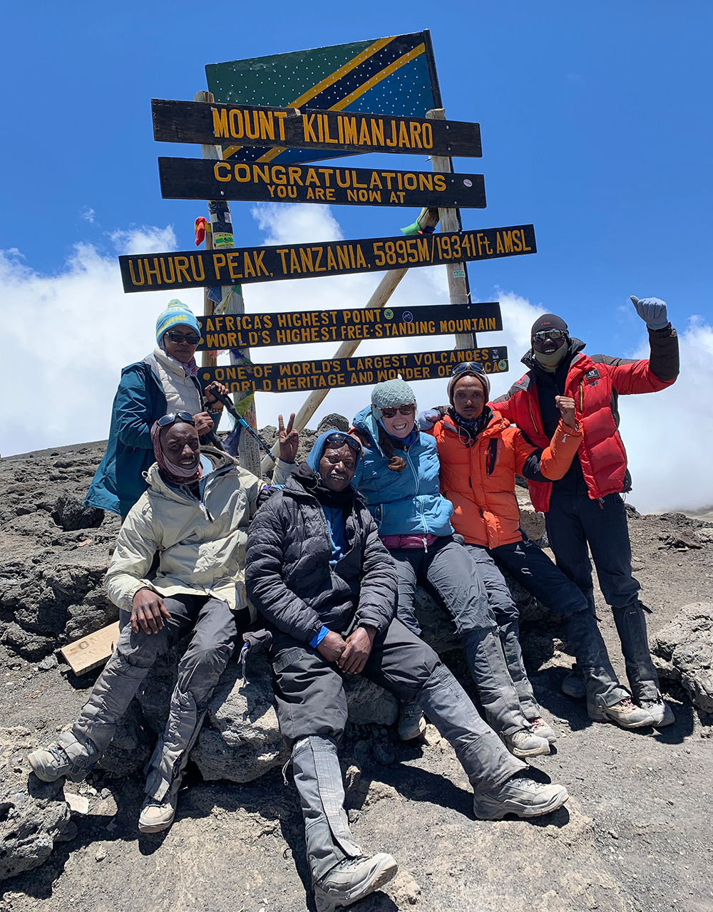 brittany at summit with guides and porter