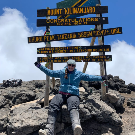 thomson staffer brittany at summit of mount kilimanjaro
