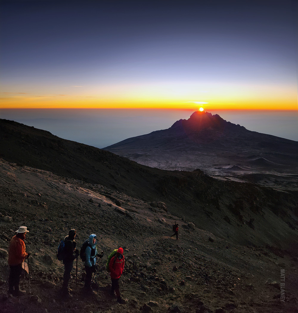 kili trekkers with sunrise over mount mawenzi