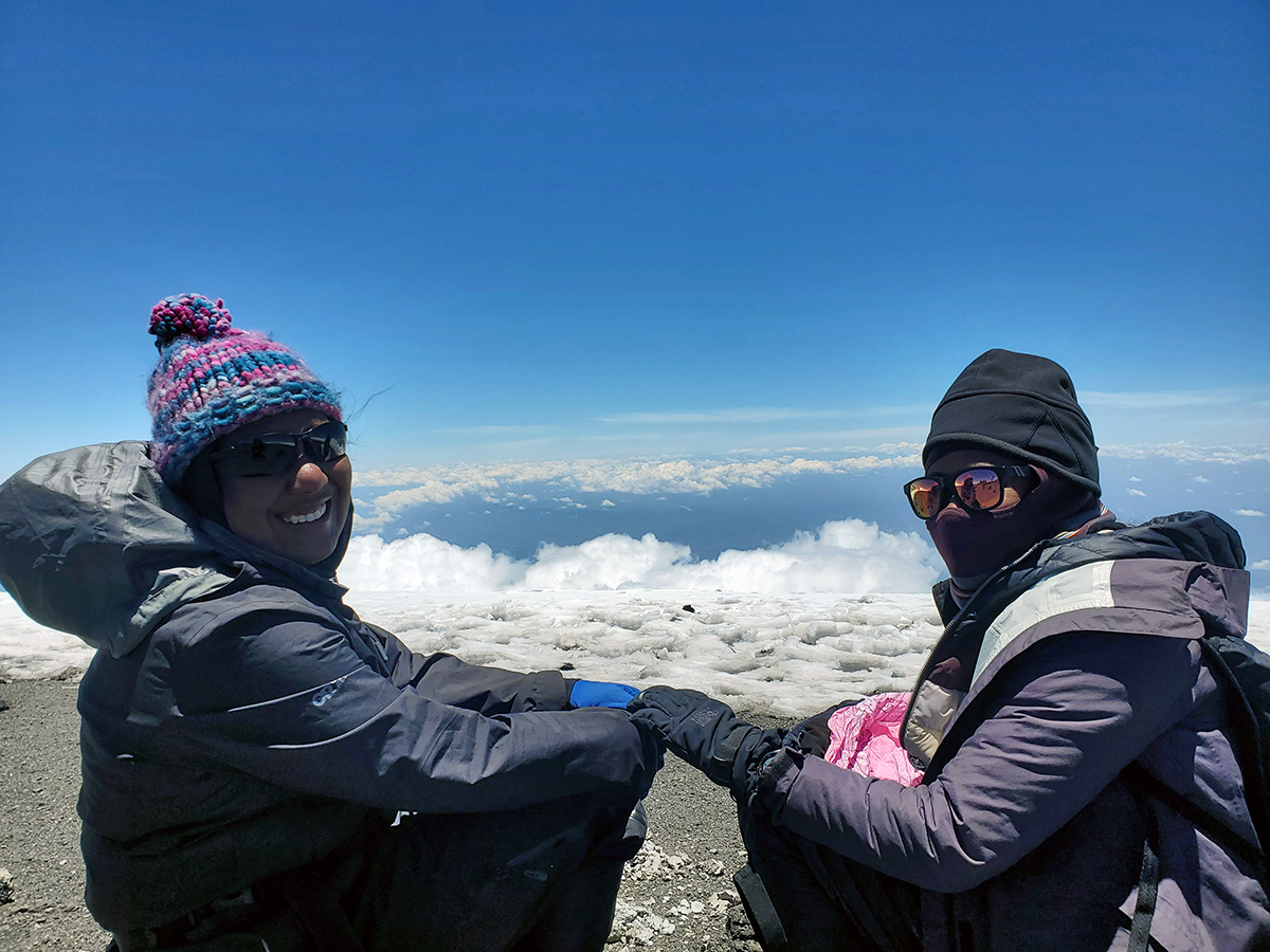 sisters support each other on kilimanjaro trek