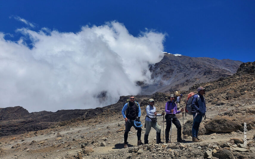 trekkers in alpine desert zone on kilimanjaro