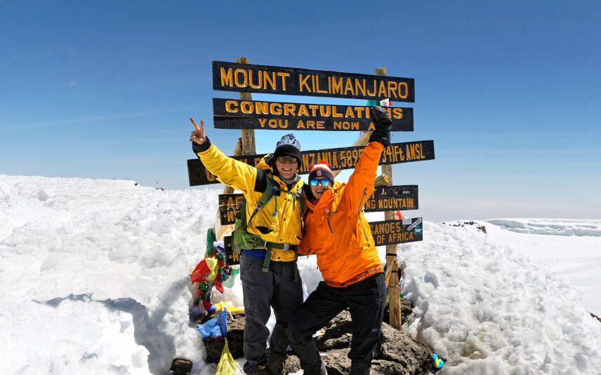couple at summit of mount kilimanjaro
