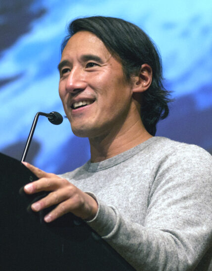 Jimmy Chin speaking in auditorium