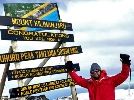 Scot Farber at Uhuru Peak during his charity climb for make a wish foundation