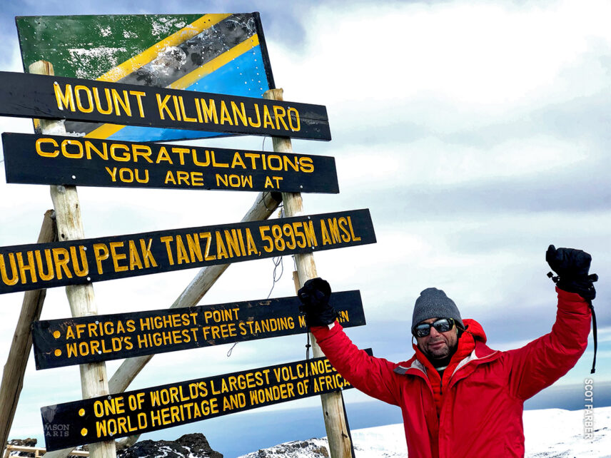 Scot Farber at Uhuru Peak during his charity climb for make a wish foundation