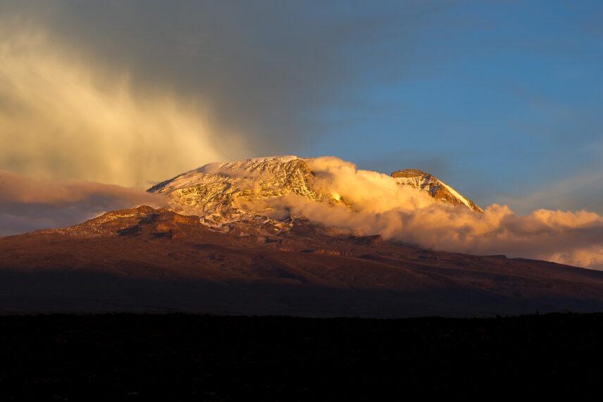 view of snow on kibo peak of kilimanjaro at sunset