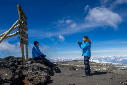 kilimanjaro trekkers taking photo at summit