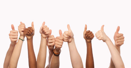 multiple arms showing thumbs up approval