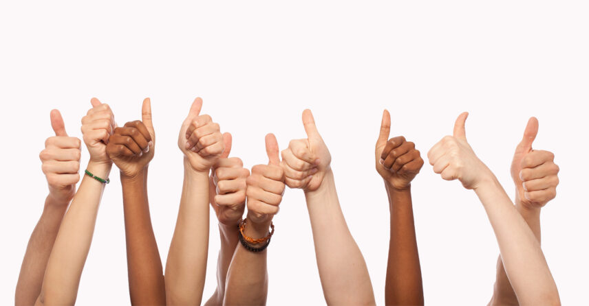 multiple arms showing thumbs up approval