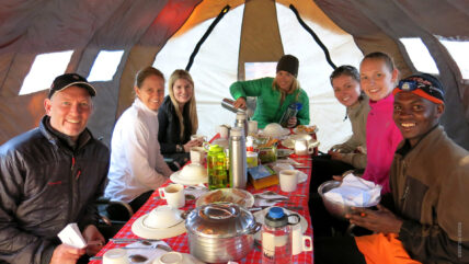 kilimanjaro trekkers in dining tent on mountain