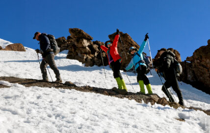 trekkers in snow on way to summit of kilimanjaro