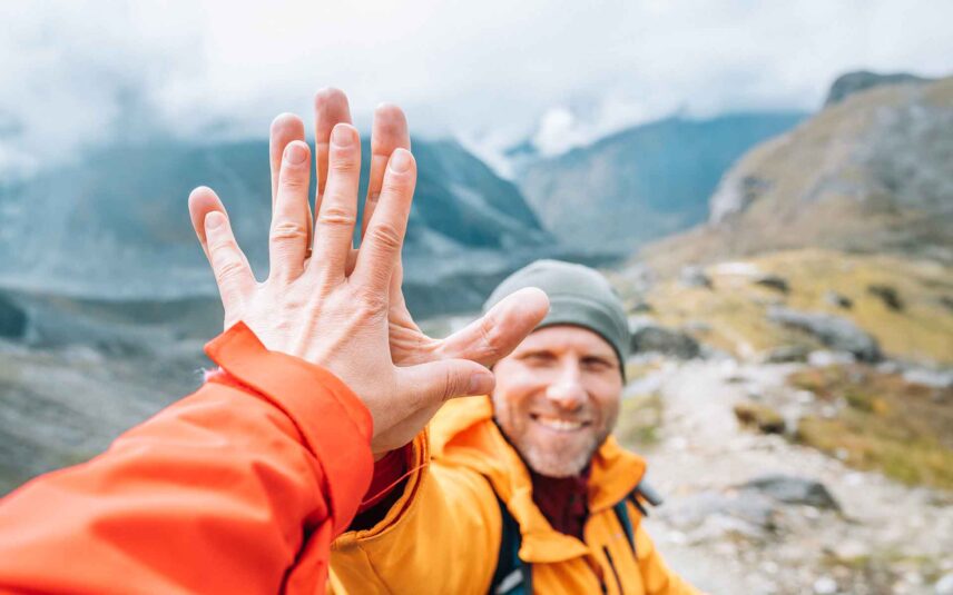 high fives on mountain